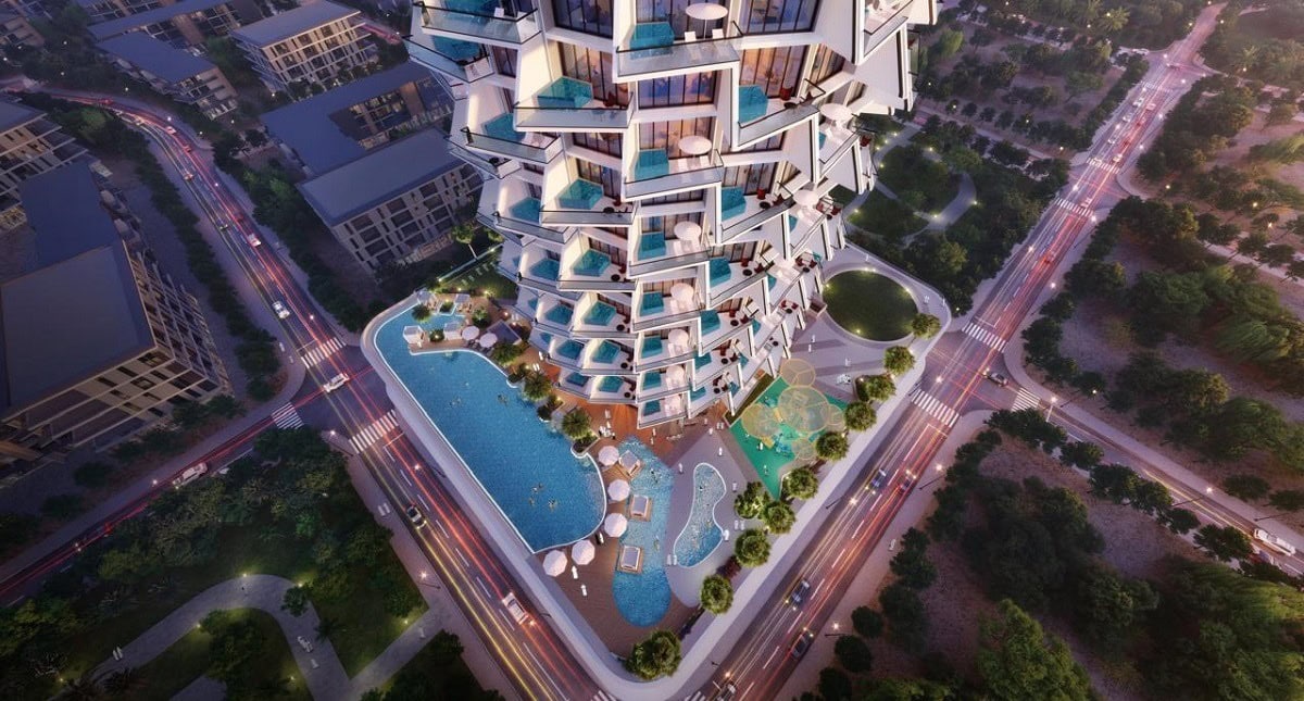 Aerial view of a unique, modern high-rise with stacked terraces, swimming pools, and lush greenery—ideal for those seeking flats in Dubai or exploring real estate investment in Dubai at a vibrant city intersection.